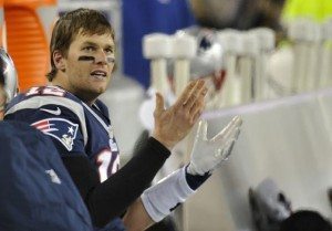New England Patriots quarterback Tom Brady reacts to the replay of a fumble recovered by the Baltimore Ravens during the fourth quarter in the NFL AFC Championship football game in Foxborough