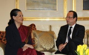Chief of India's ruling Congress party Gandhi smiles as she speaks with France's President Hollande during their meeting in New Delhi
