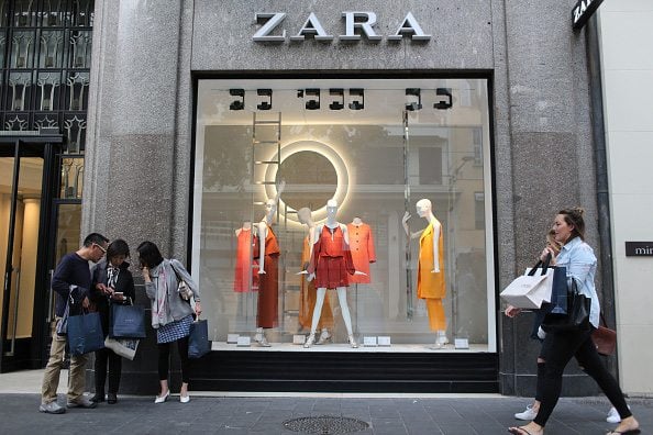 Shoppers pass the window display of a Zara fashion store, operated by Inditex SA, in Nice, France, on Thursday, May 14, 2015. The European Commission and the International Monetary Fund both see expansion of more than 1 percent this year, more than twice the annual pace recorded since President Francois Hollande came to power in 2012. Photographer: Andrey Rudakov/Bloomberg via Getty Images